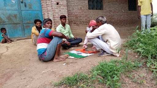 chitrakoot news people playing cards on national flag tiranga