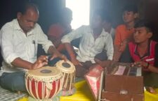 Nathuram of Mahoba teaches music to children
