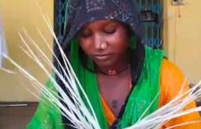 Women making mats from palm leaves