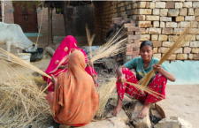 Work of making brooms brings moments of joy to women.