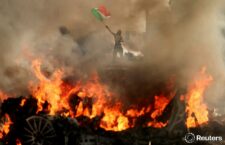 Representational image of protesters and fire in Los Angeles