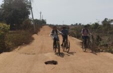 People walking helplessly on bad road