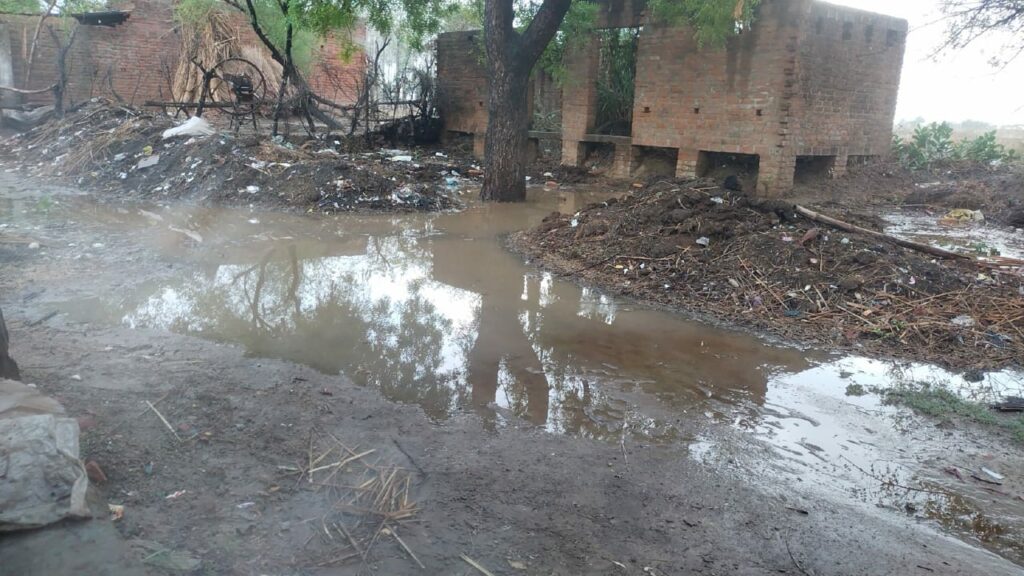 The street is filled with dirty water