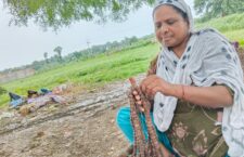 Woman making Rudraksha beads