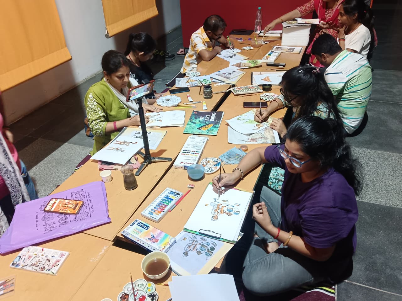 The name of the girl making the painting is Amrita Shambhavi