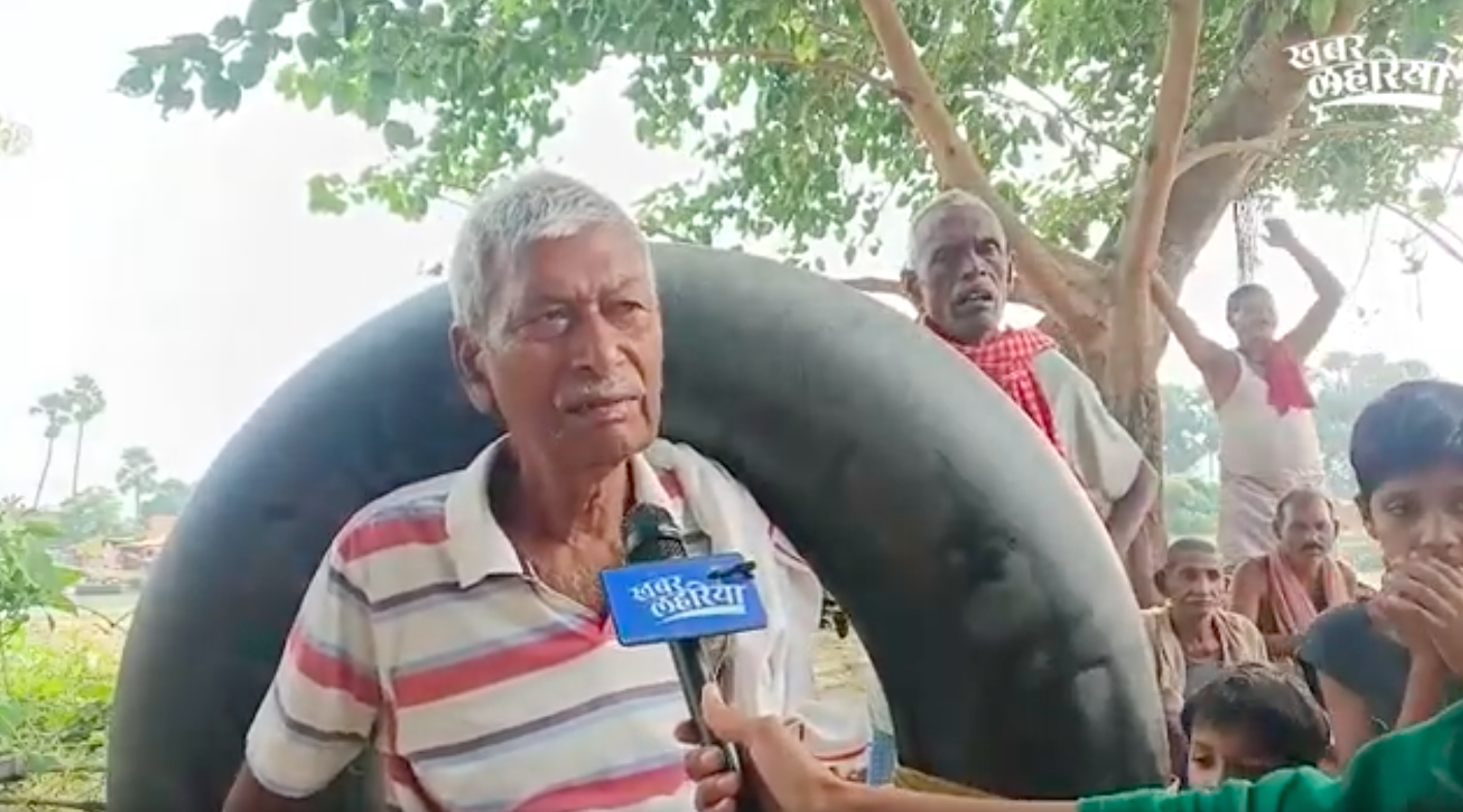 Vijay, the village elder who tubes across the river