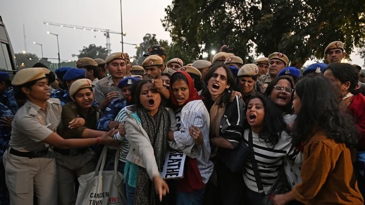 Women were dragged into a bus during the protest.